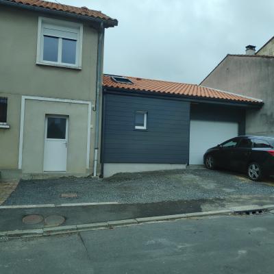 Extension d'une maison en ossature bois - Garage et pièce de vie
